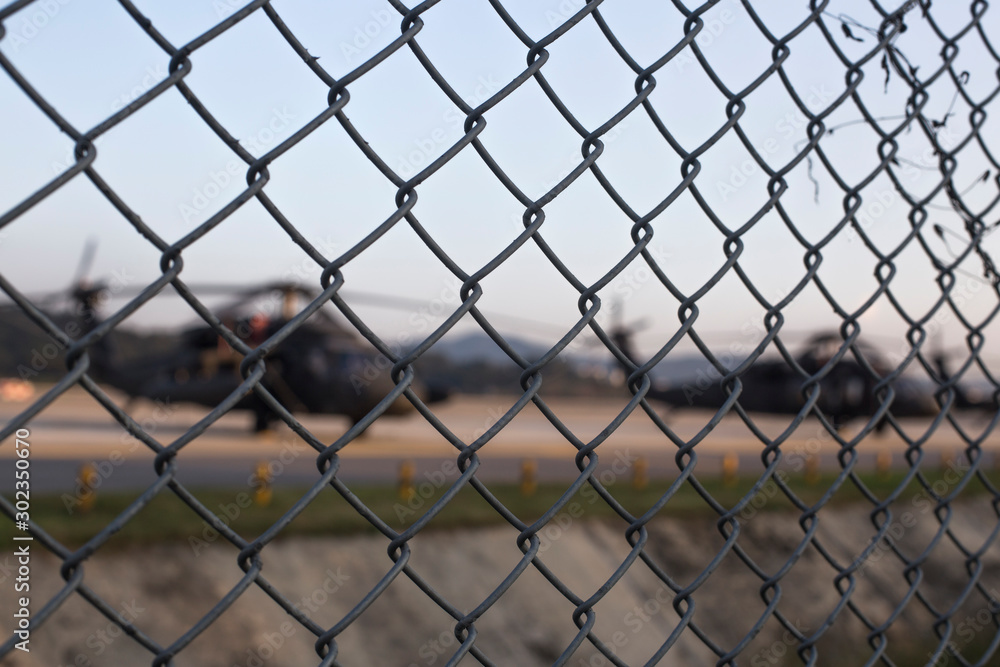 Fototapeta premium helicopter runway behind the fence