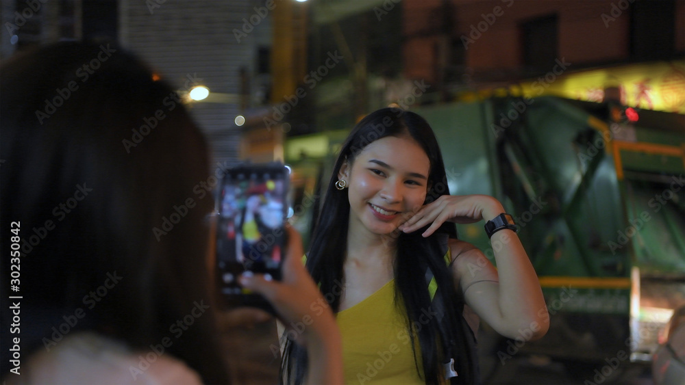 Travel concept. Young female tourists taking pictures and playing in the city. 4k Resolution. Travel concept. Young female tourists taking pictures and playing in the city. 4k Resolution.