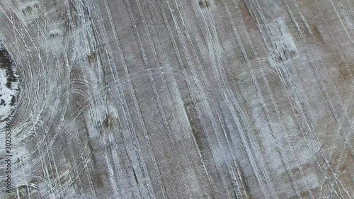 Aerial view of a farm field in winter with snow