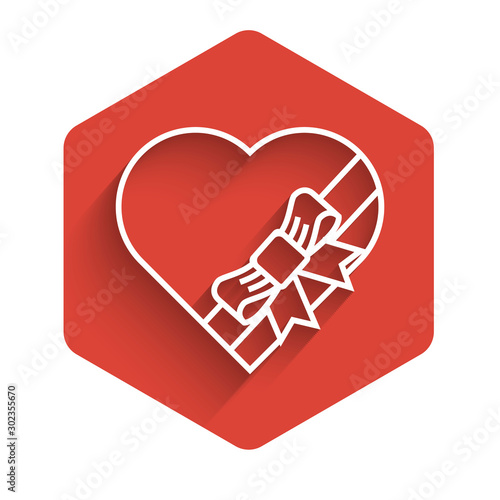 White line Candy in heart shaped box and bow icon isolated with long shadow. Valentines Day. Red hexagon button. Vector Illustration
