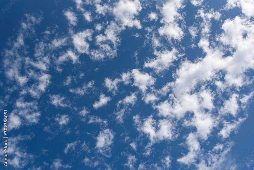 Blue sky and clean white clouds as a nature background