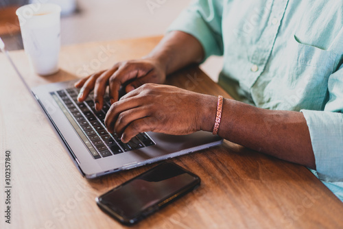 hands typing on laptop keyboard