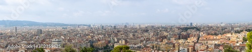 Barcelona, Spain - august 2019: panoramic background of Barcelona, extra long view. A lot of building, horizon and cloudy sky. Selective soft focus. Blurred background