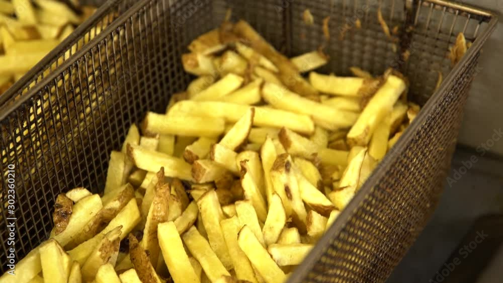 Hot Rack of Freshly Cooked Golden French Fries Hot Rack of Freshly Cooked Golden French Fries