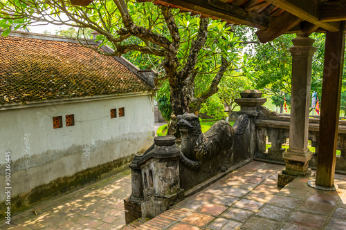 A  stone mascot in ancient Co Loa citadel, Vietnam. Co Loa was capital of Au Lac (old Vietnam), the country was founded by Thuc Phan about 2nd century BC. photo