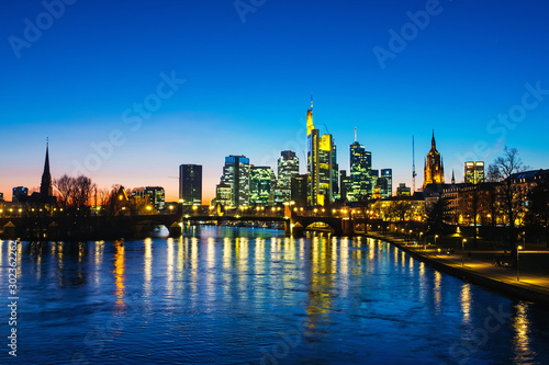 Skyline of Frankfurt  Germany in the sunset with famous illuminated skyscrapers