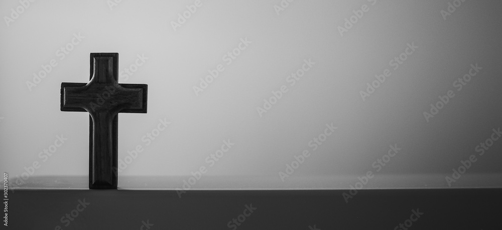 Wooden cross on isolated white background black and white style, blank copy space, use for funeral theme