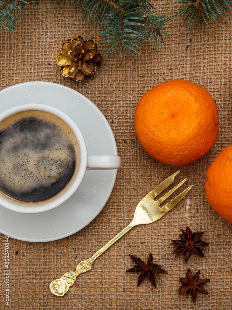 Cup of coffee, oranges, star anise and cinnamon Cup of coffee, oranges, star anise and cinnamon