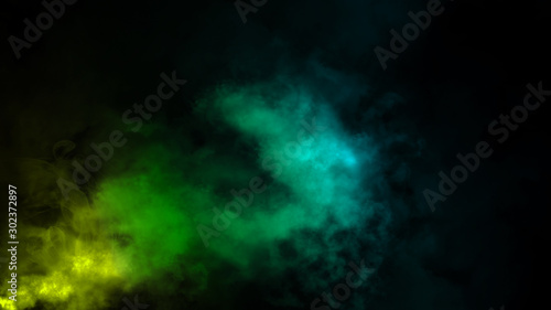 Abstract colorful fog smoke moves on isolated black background . The concept of aromatherapy