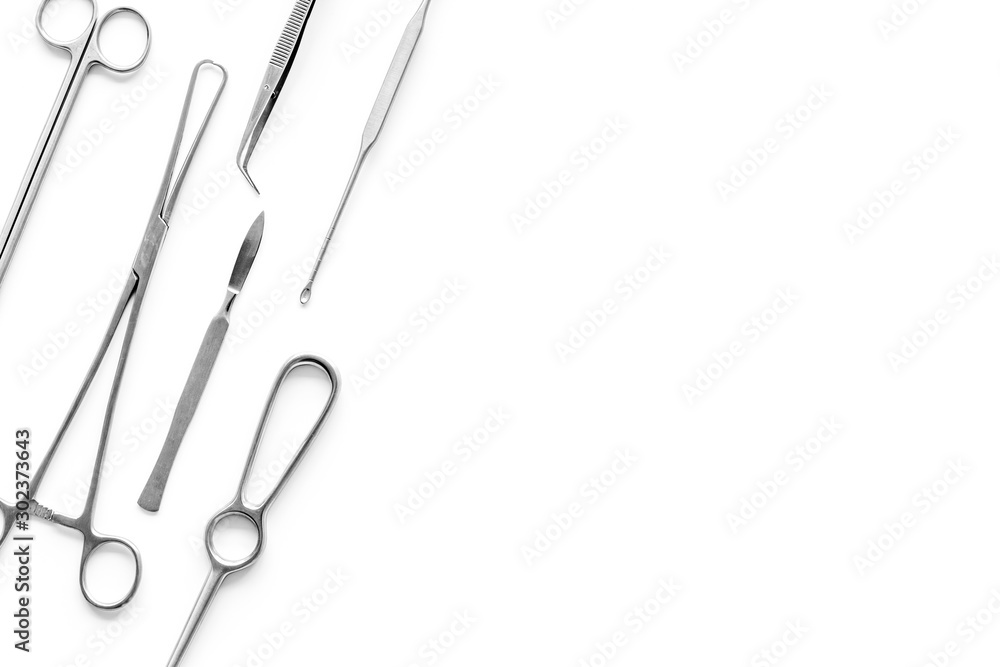 Plastic surgery. Instruments for beauty operations on white background top view frame copy space Plastic surgery. Instruments for beauty operations on white background top view frame copy space