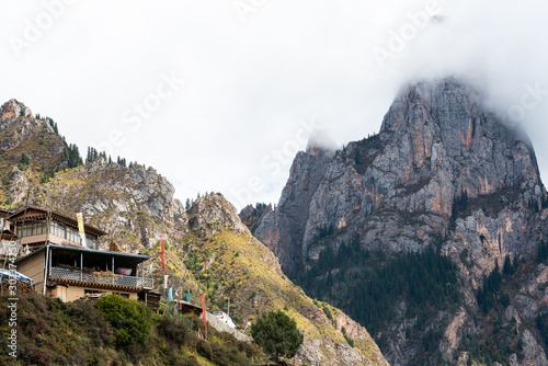 Cloudy peak and a house