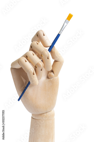 Single wooden hand holding painters brush isolated on white