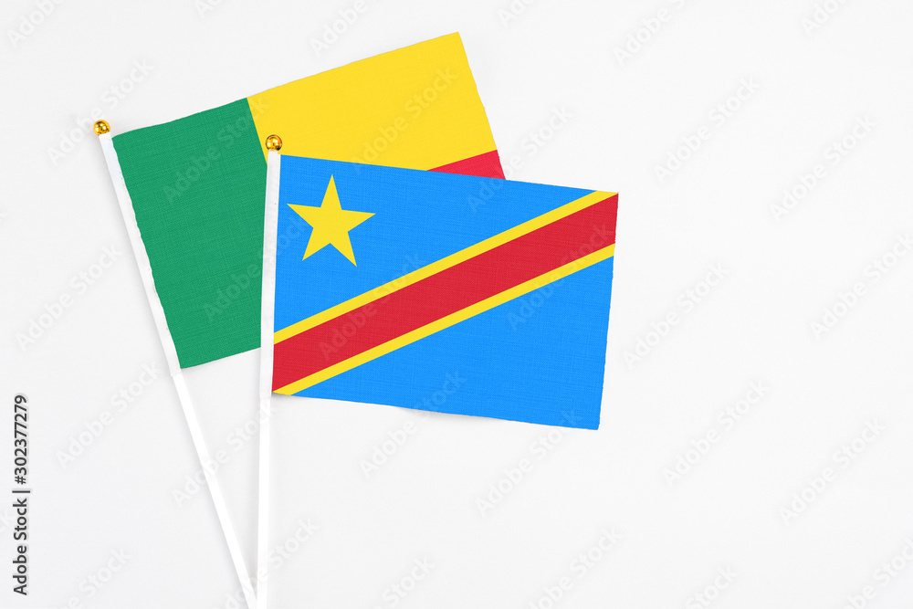 Congo and Benin stick flags on white background. High quality fabric, miniature national flag. Peaceful global concept.White floor for copy space. Congo and Benin stick flags on white background. High quality fabric, miniature national flag. Peaceful global concept.White floor for copy space.