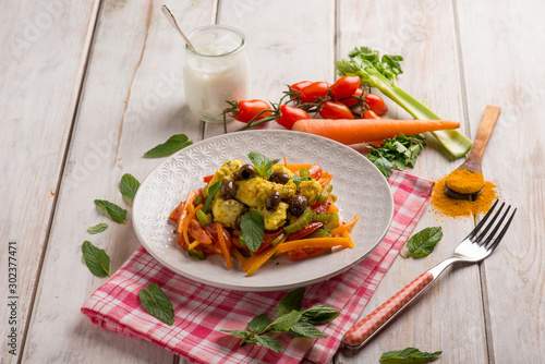 chicken stewed with curry carrots mint and olives