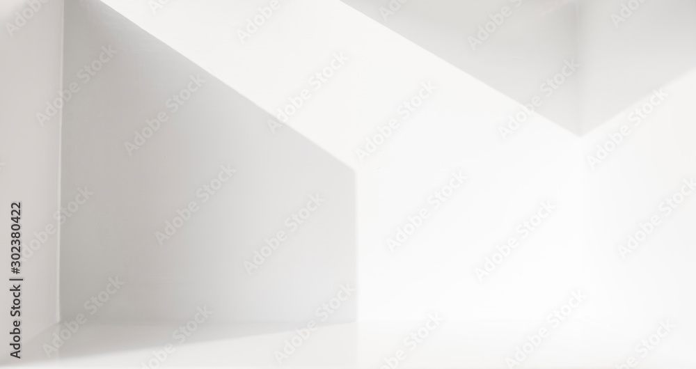 The scene in a white room with empty space and refraction of light and shadow The scene in a white room with empty space and refraction of light and shadow