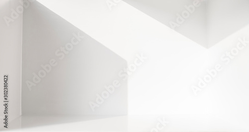 The scene in a white room with empty space and refraction of light and shadow