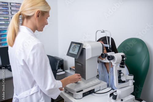 Screen showing eye of patient while eye doctor making examination