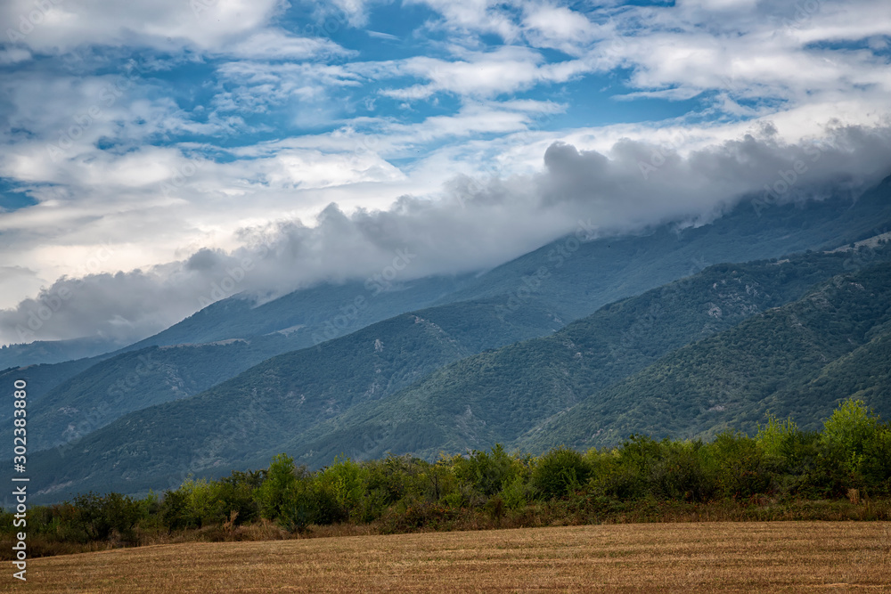 Beauty landscape of fog and clouds rolling over the forested mountain Beauty landscape of fog and clouds rolling over the forested mountain