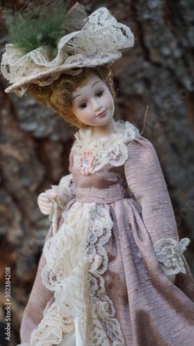 A vintage doll with classic dress