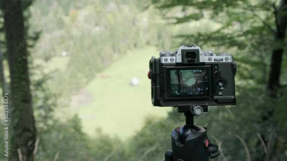 Fujifilm camera taking photos of breathtaking views in the mountains Fujifilm camera taking photos of breathtaking views in the mountains