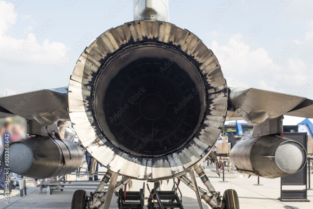 View of big round nozzle of modern military aircraft.