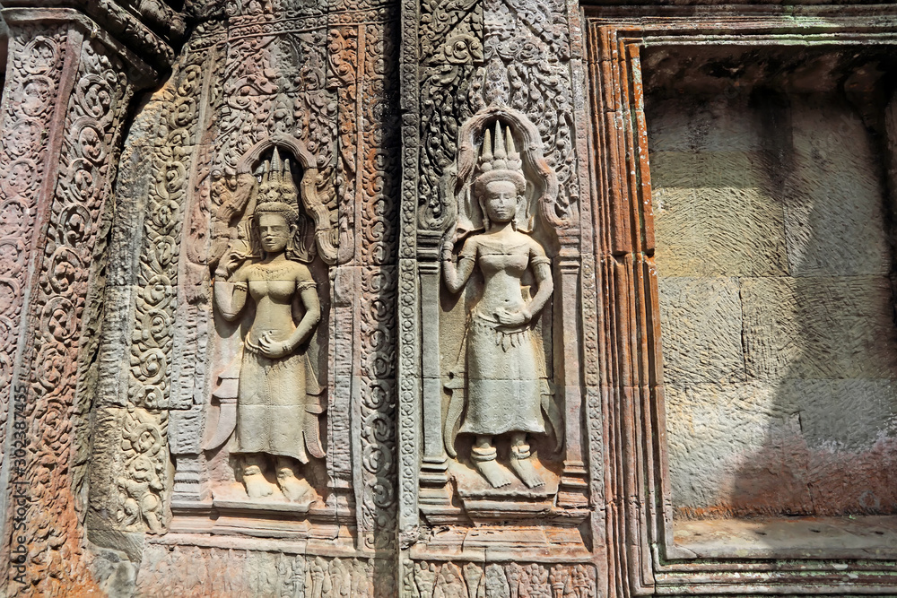View of old sculptures and Stone murals at Ta Prohm of Angkor Wat Cambodia