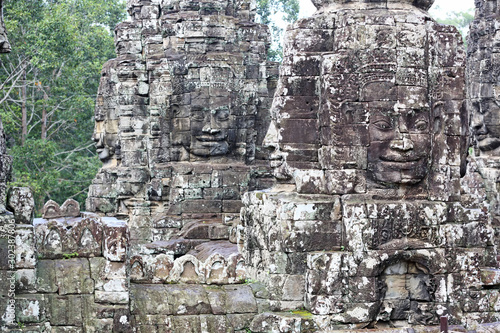 Ancient stone faces of Bayon temple in complex Angkor Wat in Siem Reap, Cambodia 