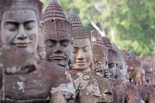 Row of sculptures faces of Bayon Temple, Angkor Wat in Siem Reap, Cambodia