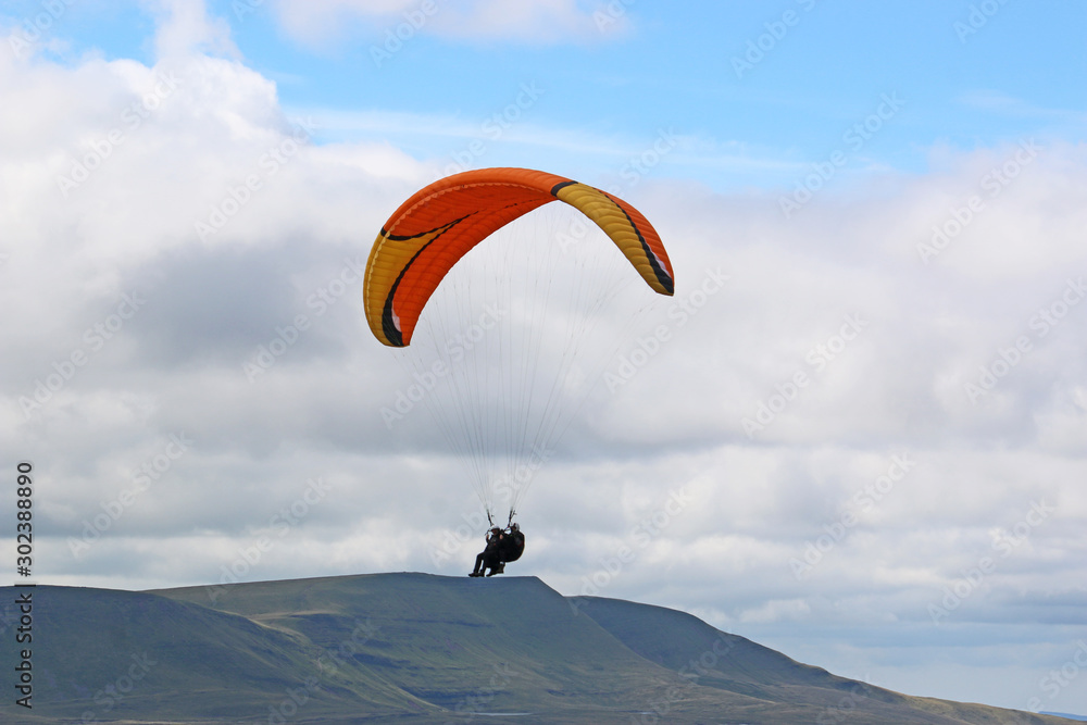 Tandem Paraglider in the Brecon Beacons, Wales Tandem Paraglider in the Brecon Beacons, Wales