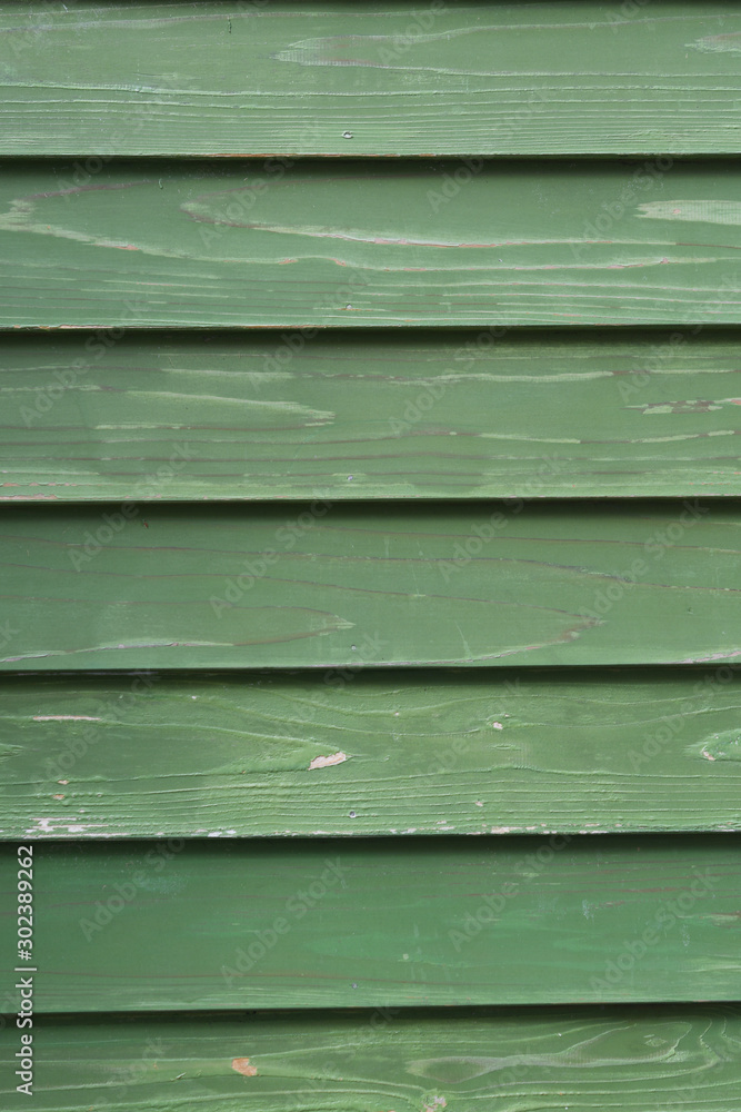 Fototapeta premium 緑色の木製の壁