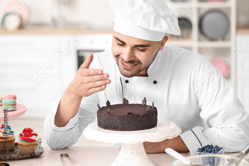 Male confectioner with tast...