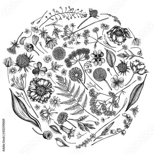 Round floral design with black and white shepherd s purse, heather, fern, wild garlic, clover, globethistle, gentiana, astilbe, craspedia, lagurus, black caraway, chamomile, dandelion, poppy flower photo