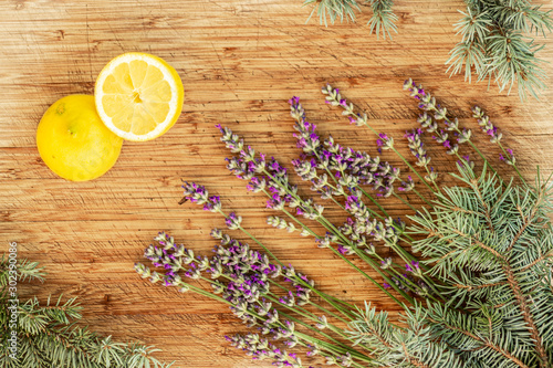 Lemon and lavender on wooden table top view, flatlay healthy vitamins