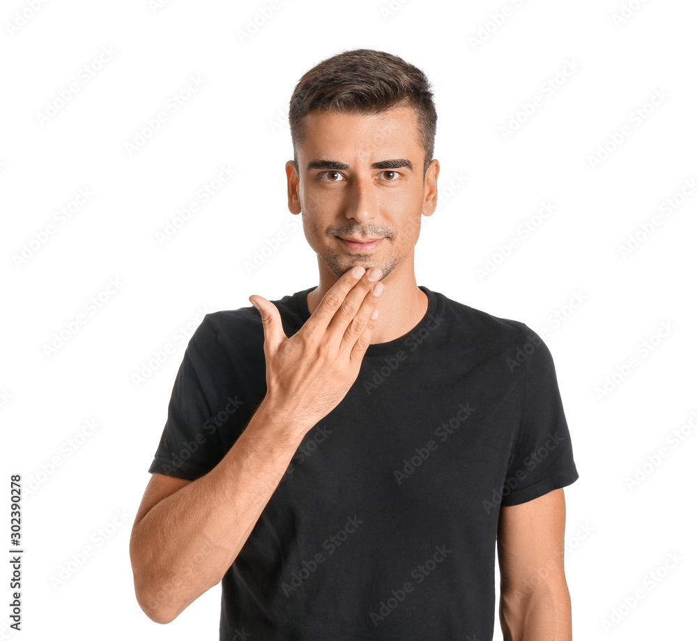 Young deaf mute man using sign language on white background Young deaf mute man using sign language on white background