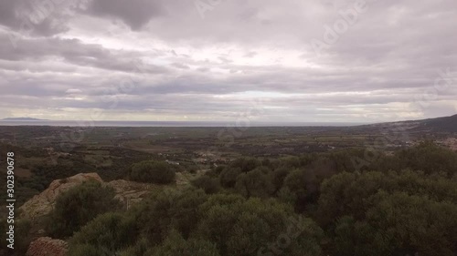 aerial view from above on the valley of valledoria badesi santa maria coghinas with the background of the sea and the Mediterranean maquis with heavy clouds photo