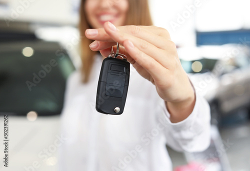 Happy woman with key from n...