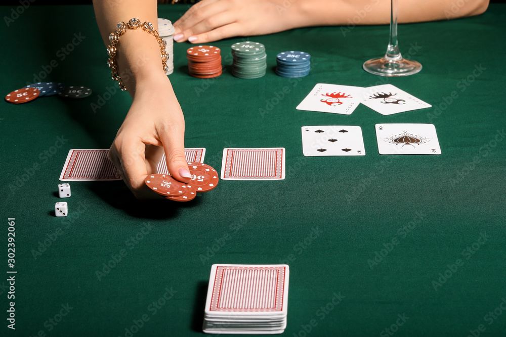 Female player at table in casino, closeup Female player at table in casino, closeup