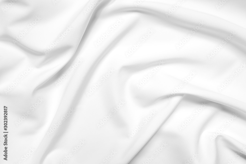 Fototapeta premium Abstract white fabric texture background. Cloth soft wave. Creases of satin, silk, and cotton.