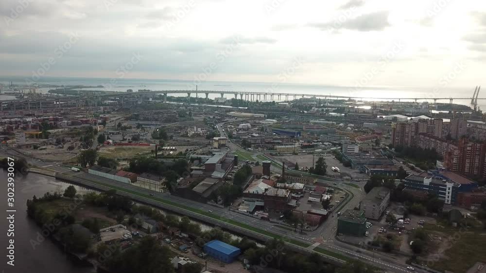Drone view of the industrial part of St. Petersburg, Kanonersky island with Western high-speed diameter and the Gulf of Finland on the horizon Drone view of the industrial part of St. Petersburg, Kanonersky island with Western high-speed diameter and the Gulf of Finland on the horizon