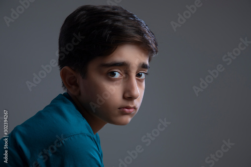 Portrait of a sad young boy. (Children) 	 photo
