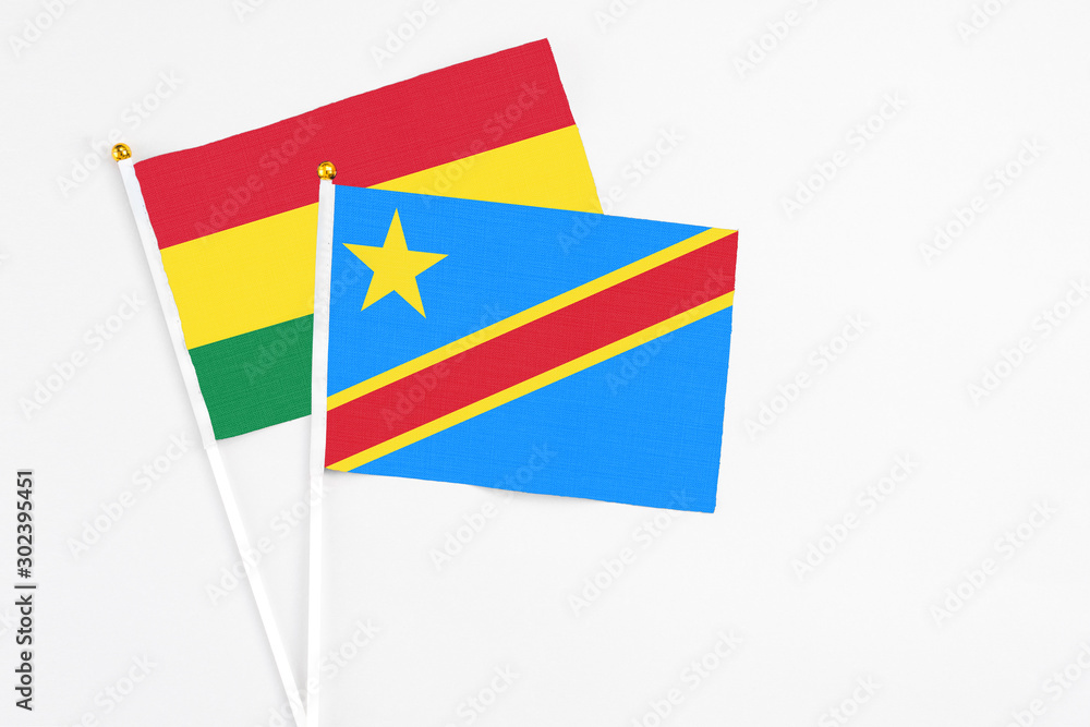 Congo and Bolivia stick flags on white background. High quality fabric, miniature national flag. Peaceful global concept.White floor for copy space. Congo and Bolivia stick flags on white background. High quality fabric, miniature national flag. Peaceful global concept.White floor for copy space.