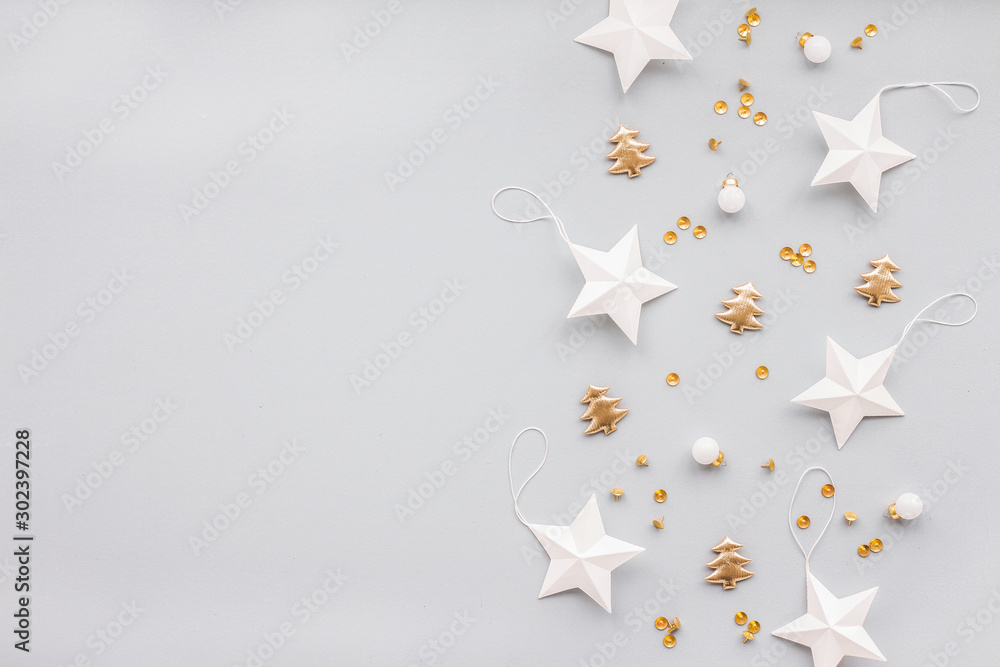 Gold and white christmas decoration on pastel blue background, flat lay, top view - obrazy, fototapety, plakaty 