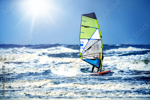 Windsurfing, Fun and action in the ocean water. Extreme sunny sport .