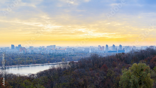 Panorama of Kyiv city and Dnipro river at sunrise in dawn  panoramic view to the colorful autumn cityscape in the morning  Ukraine