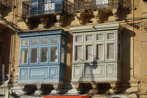 Typical buildings of Malta with gallarija, traditional enclosed wooden balconies photo