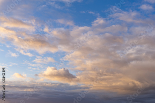 blue sky with white clouds at sunrise