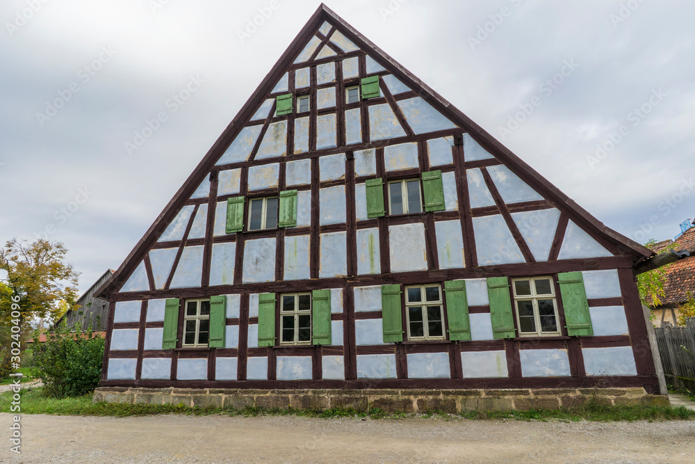 Bad Windsheim, Germany - 16 October 2019: View from a half timbered house in a german village. Bad Windsheim, Germany - 16 October 2019: View from a half timbered house in a german village.