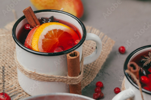 Christmas hot mulled wine in rustic cup close up