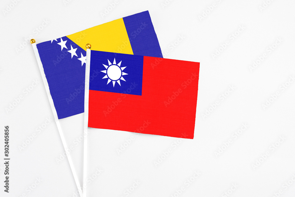 Taiwan and Bosnia Herzegovina stick flags on white background. High quality fabric, miniature national flag. Peaceful global concept.White floor for copy space. Taiwan and Bosnia Herzegovina stick flags on white background. High quality fabric, miniature national flag. Peaceful global concept.White floor for copy space.
