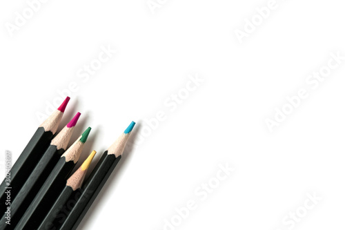 Colored wooden pencils on white isolated background